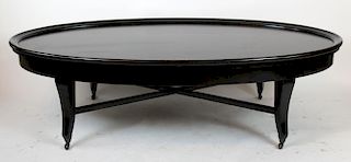 Oversize black oval coffee table on casters