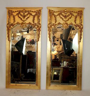 Pair of gold trumeau beveled mirrors