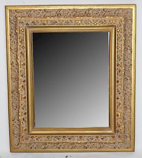 Ornate gilt frame beveled mirror