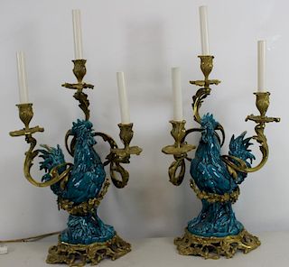 A Pair of Bronze Mounted Glazed Cock Form Lamps.