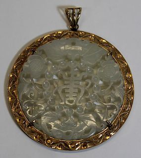 JEWELRY. 14kt Gold and Carved Jade Pendant.