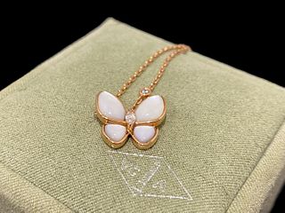 Van Cleef & Arpels Butterfly pendant. 18k rose gold, Diamond, Mother-of- pearl.