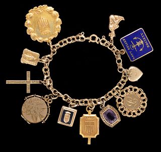 VINTAGE 14K YELLOW GOLD BRACELET WITH GOLD AND OTHER CHARMS