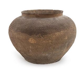 * A Pottery Vessel Height 5 1/4 x diameter 7 3/4 inches.