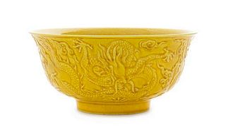 A Carved Yellow Glazed Porcelain Bowl Diameter 6 1/8 inches.