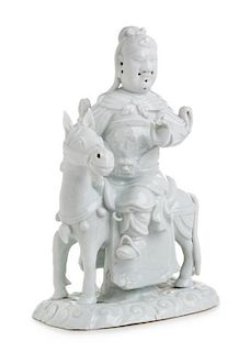 A Blanc-de-Chine Porcelain Figural Group Height 10 1/4 inches.