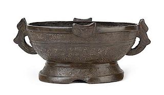 An Archaistic Bronze Vessel Length 10 1/4 inches.