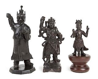 Three Bronze Figures of Guardians Height of tallest 11 inches.