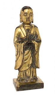 A Gilt Bronze Figure of a Standing Buddha Height 8 3/4 inches.