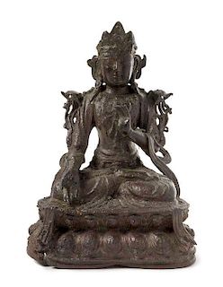 A Cast Iron Figure of a Bodhisattva Height 11 3/4 inches.