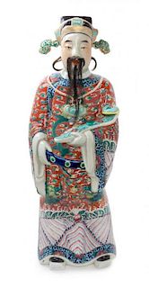 A Famille Rose Porcelain Figure of an Immortal Height 25 inches.