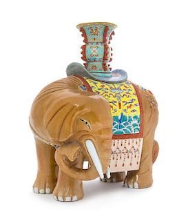 A Famille Rose Porcelain Elephant-Form Candle Holder Height 12 3/4 inches.