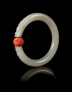 A Carved Celadon Jade Bangle Diameter 3 1/4 inches.