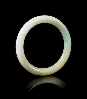 An Apple Green and Celadon Jadeite Bangle Diameter 3 3/4 inches.