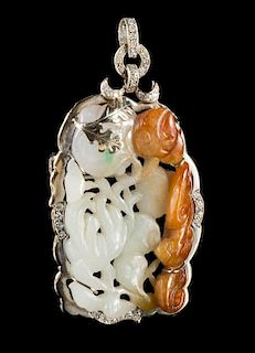 A Carved Jadeite Pendant Length 2 1/2 inches.