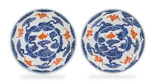 A Pair of Iron Red Decorated Underglaze Blue Porcelain Dishes Diameter of each 5 3/4 inches.