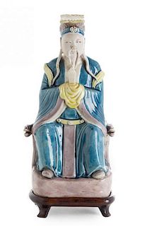 A Turquoise, Yellow and Aubergine Biscuit Glazed Figure of a Daoist Immortal Height 10 1/2 inches.