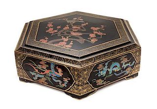 A Black Lacquer Covered Box Diameter 19 3/4 inches.