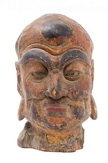 A Painted Wood Head of a Luohan Height 19 inches.