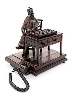 A Carved Wood Figural Group Telephone Height 12 1/4 inches.