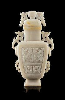 A White Jadeite Covered Vase Height 8 1/2 inches.
