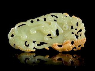 A Reticulated Celadon and Russet Jade Plaque Length 3 5/8 inches.