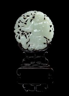A Carved Celadon Jade Circular Plaque Diameter 3 1/4 inches.
