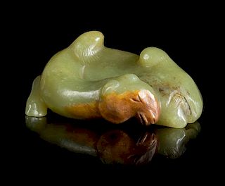 A Carved Celadon Jade Figure of a Camel Length 2 3/4 inches.