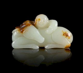 A Carved White and Russet Jade Figural Group of a Boy and a Horse Length 2 1/4 inches.