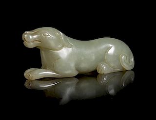 A Carved Celadon Jade Figure of a Hound Length 3 inches.