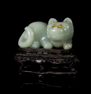 * A Carved Celadon Jade Figure of a Cat Length 6 inches.