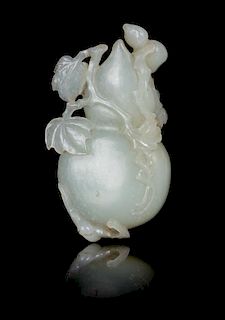 A Carved Pale Celadon Jade Toggle of a Gourd Length 3 3/4 inches.