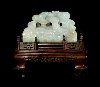 A Celadon Jade Carving Height 2 1/8 x length 3 3/4 x width 1 5/8 inches.