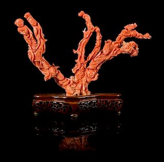 * A Carved Pink Coral Figural Group Height 6 x 9 1/2 inches.