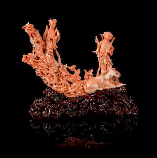 * A Carved Pink Coral Figural Group Height 6 x width 8 1/4 inches.