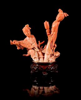 * A Pink Coral Figural Group of Two Female Musicians Height 4 3/4 inches.