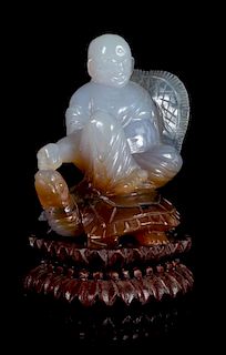 * A Carved Agate Figural Group Height 4 inches.