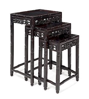 A Set of Three Chinese Rosewood Nesting Tables Height of largest 28 x width 19 1/2 x depth 14 inches.