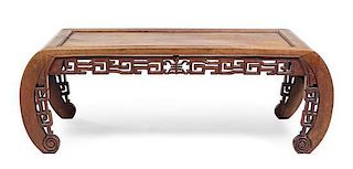 A Chinese Carved Hardwood Kang Table Height 14 1/2 x width 41 3/4 x depth 17 inches.