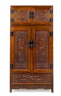 A Massive Chinese Hardwood Compound Cabinet Height 78 x width 39 1/4 x depth 19 1/2 inches.