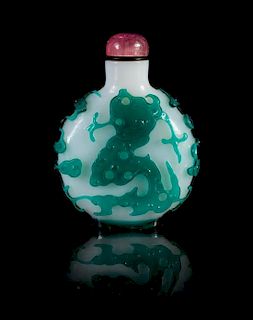 A Green Overlay Peking Glass Snuff Bottle Height 2 3/4 inches.