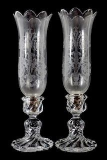 A Pair of Swirled Molded Glass Candlesticks with Hurricane Shades Height 16 inches.