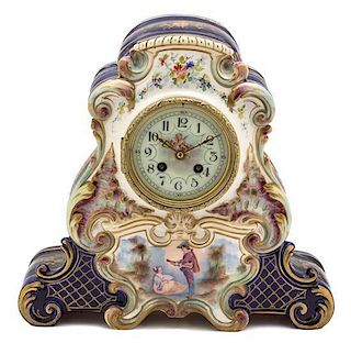 A Continental Polychrome and Gilt Decorated Pottery Clock Height 12 1/2 inches.