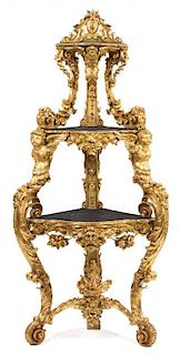 An Italian Rococo Carved Giltwood Corner Etagere Height 86 x width 37 x depth 22 inches.