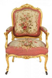 An Italian Louis XV Style Giltwood Fauteuil Height 39 inches.