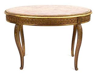 An Italian Louis XVI Style Giltwood Table Height 29 1/2 x width 47 x depth 31 3/4 inches.