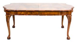 An Italian Walnut Veneered Dining Table Height 30 x width 125 1/2 x depth 47 1/2 inches.