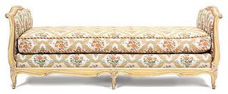 A Louis XV Style Painted and Upholstered Carved Wood Day Bed Height 31 x width 83 x depth 35 1/2 inches.