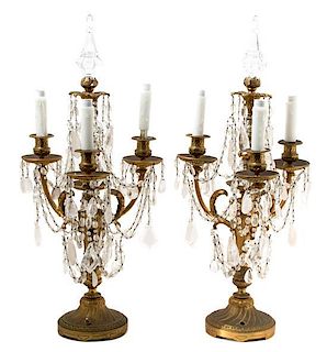 A Pair of Louis XVI Style Three-Light Gilt Bronze and Cut Crystal Candelabra Height 27 1/2 x diameter 13 inches.