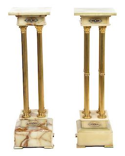A Pair of Gilt Bronze Mounted Onyx Pedestals Height 41 inches.